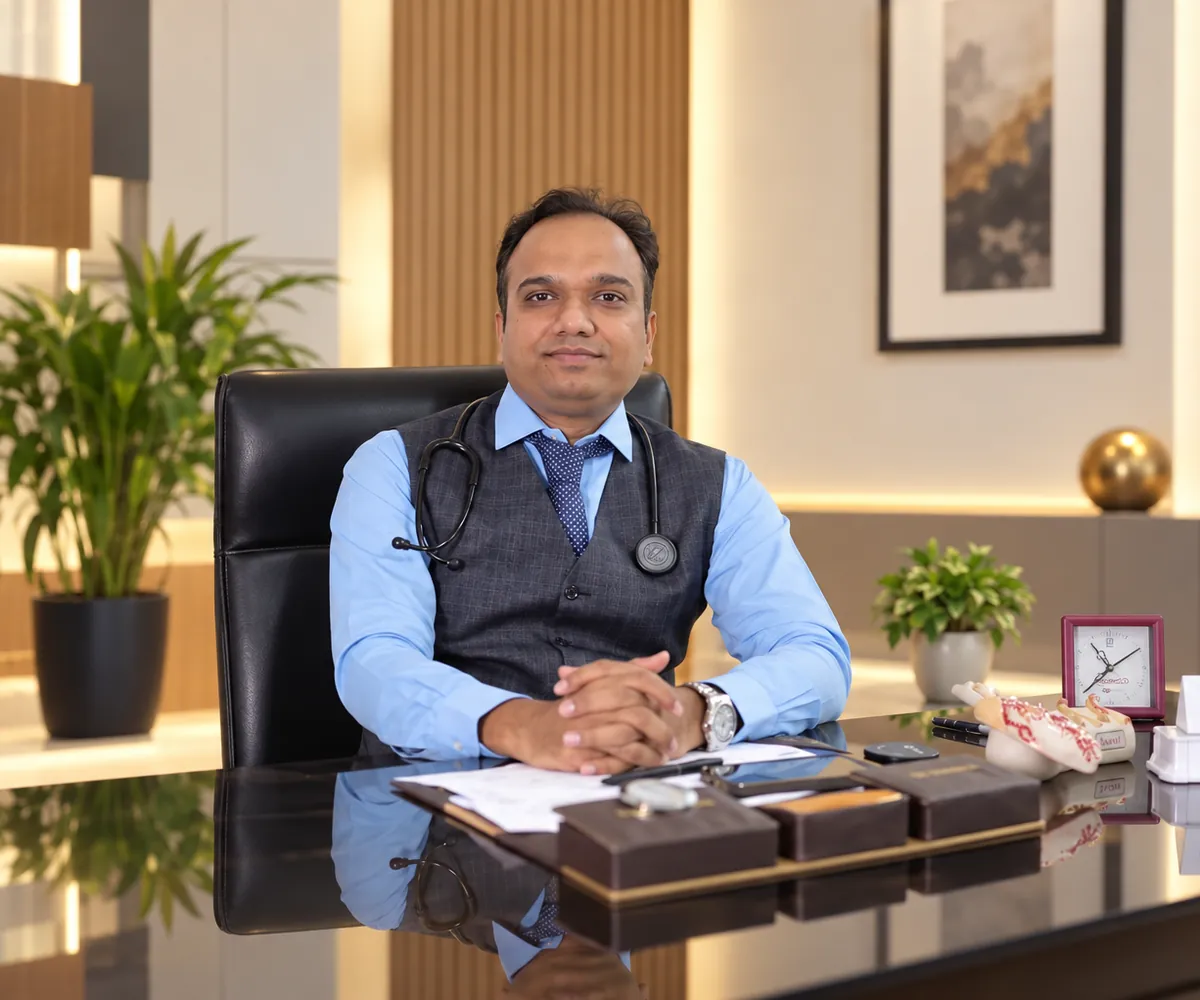 Dr. Manoj Patel, interventional cardiologist, seated at his desk at Shree Vighnaharta Superspeciality Hospital